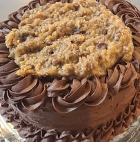 8 inch Round layered cake decorated to suit